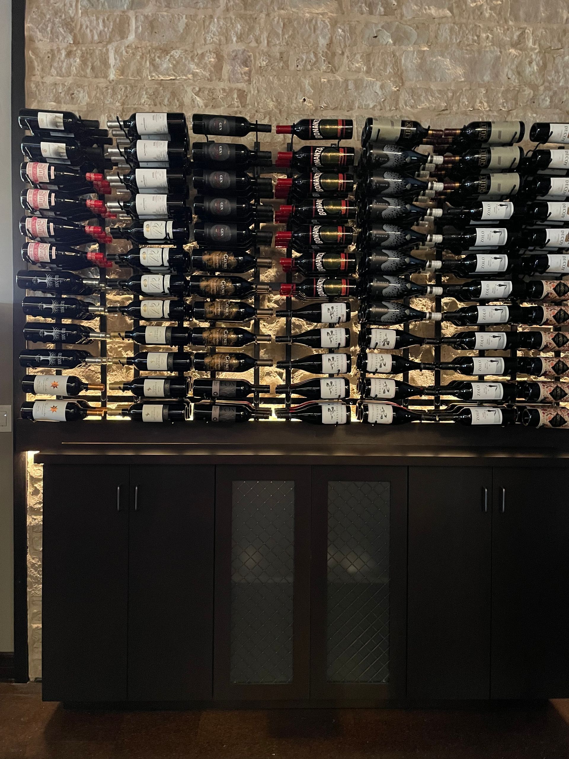 A wine rack filled with many bottles of wine