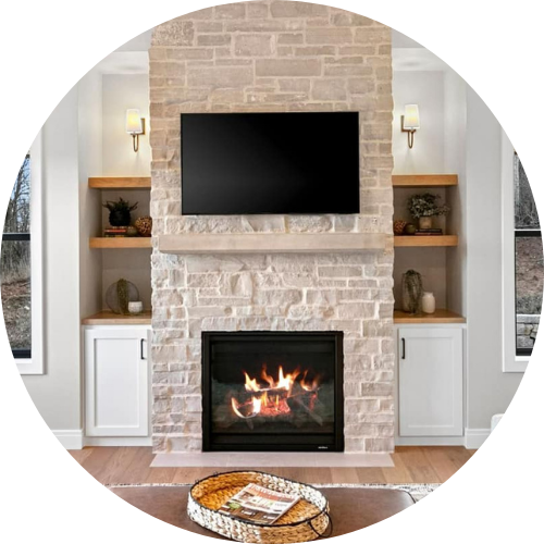 A living room with a fireplace and a flat screen tv on the wall.