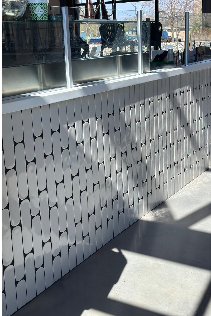 A white wall with a geometric pattern on it