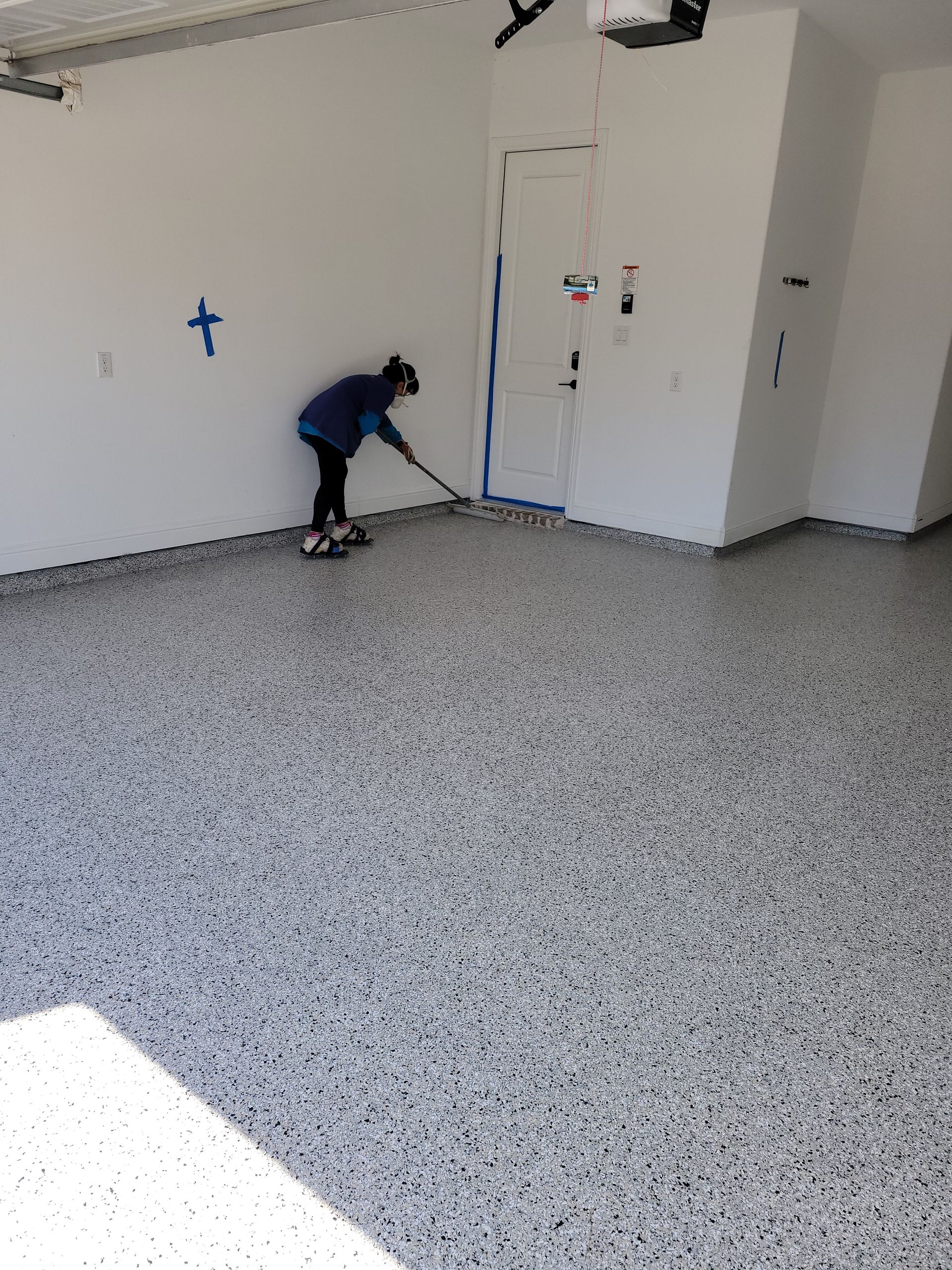 Certified installer, Christina Thayer, applying UV stable high solids Aliphatic Urathane