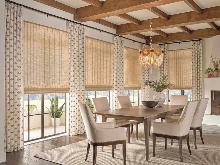 woven shades with patterned linen draperies in dining room