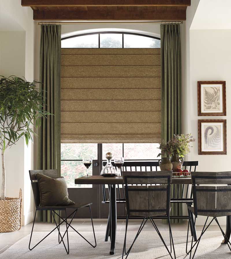 olive green pinch pleat drapes over custom roman shades in Nova Scotia dining room