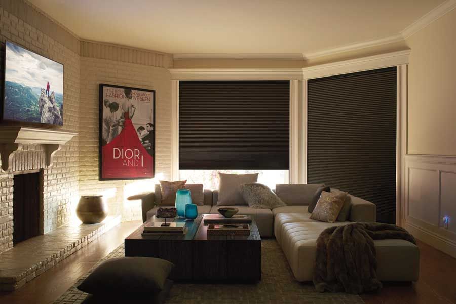 neutral roller shades in hallway of modern home
