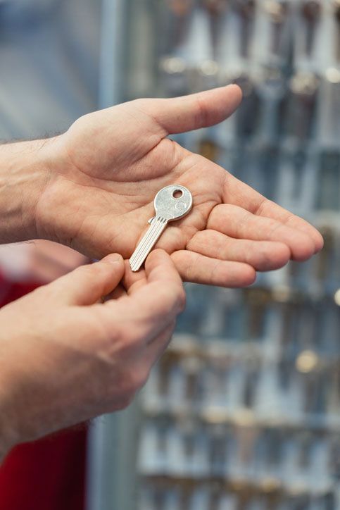 Locksmith with key blanks in his shop