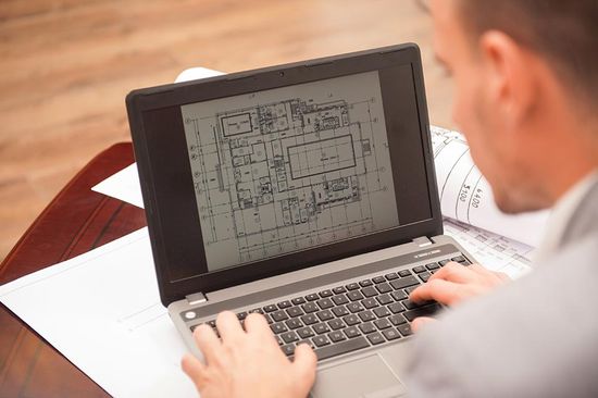 man checking the plan on computer