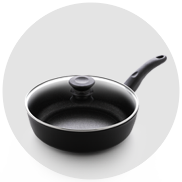 A black frying pan with a glass lid