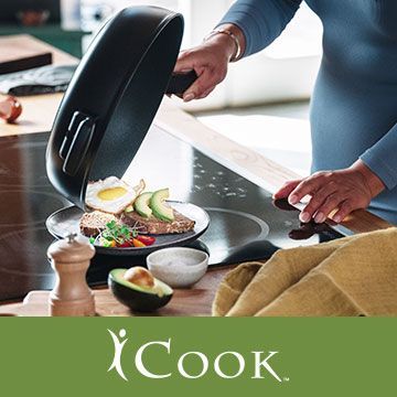 A person is cooking food in a frying pan on a stove.