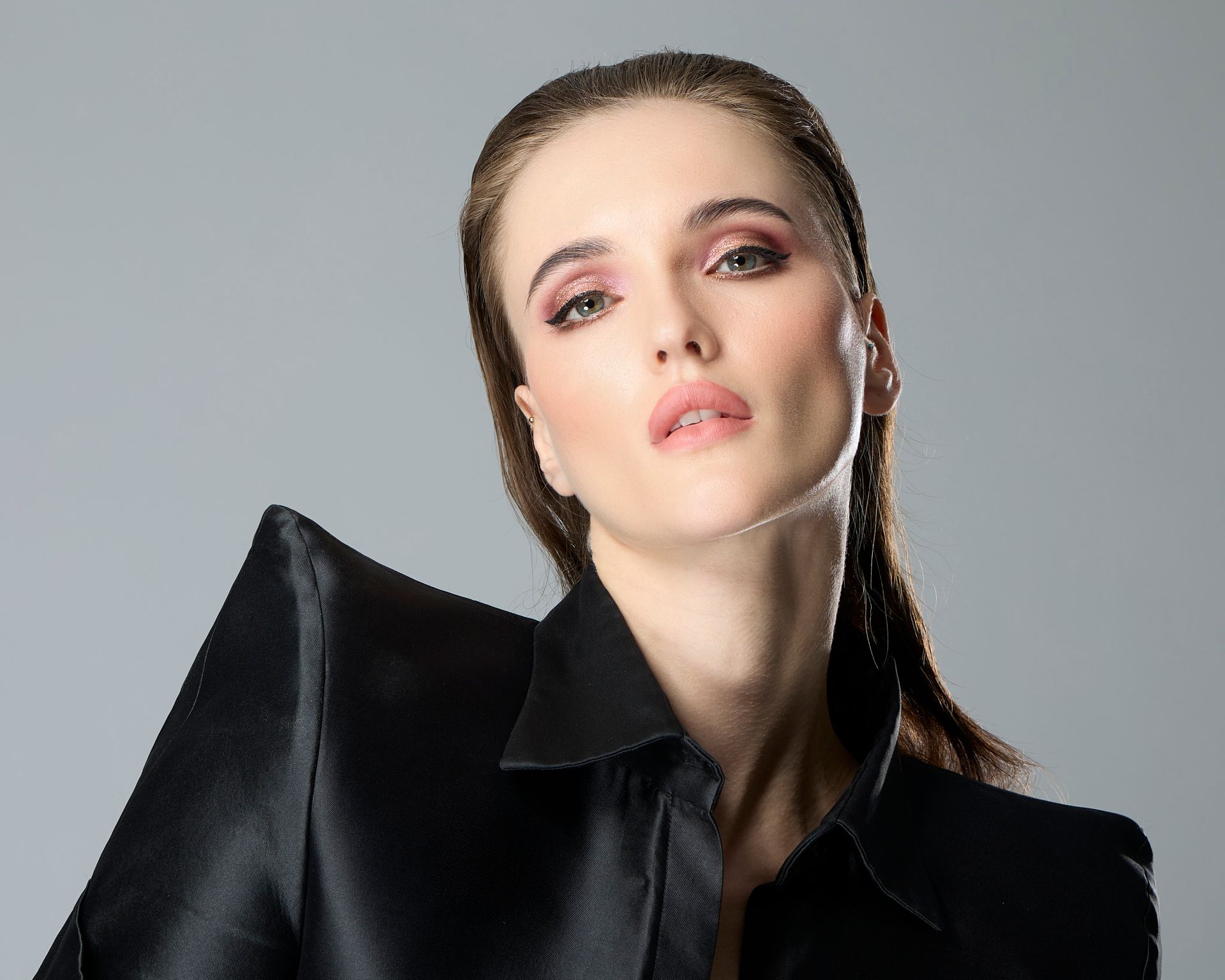 International top model wearing a elegant black gown for NY Fashion week.