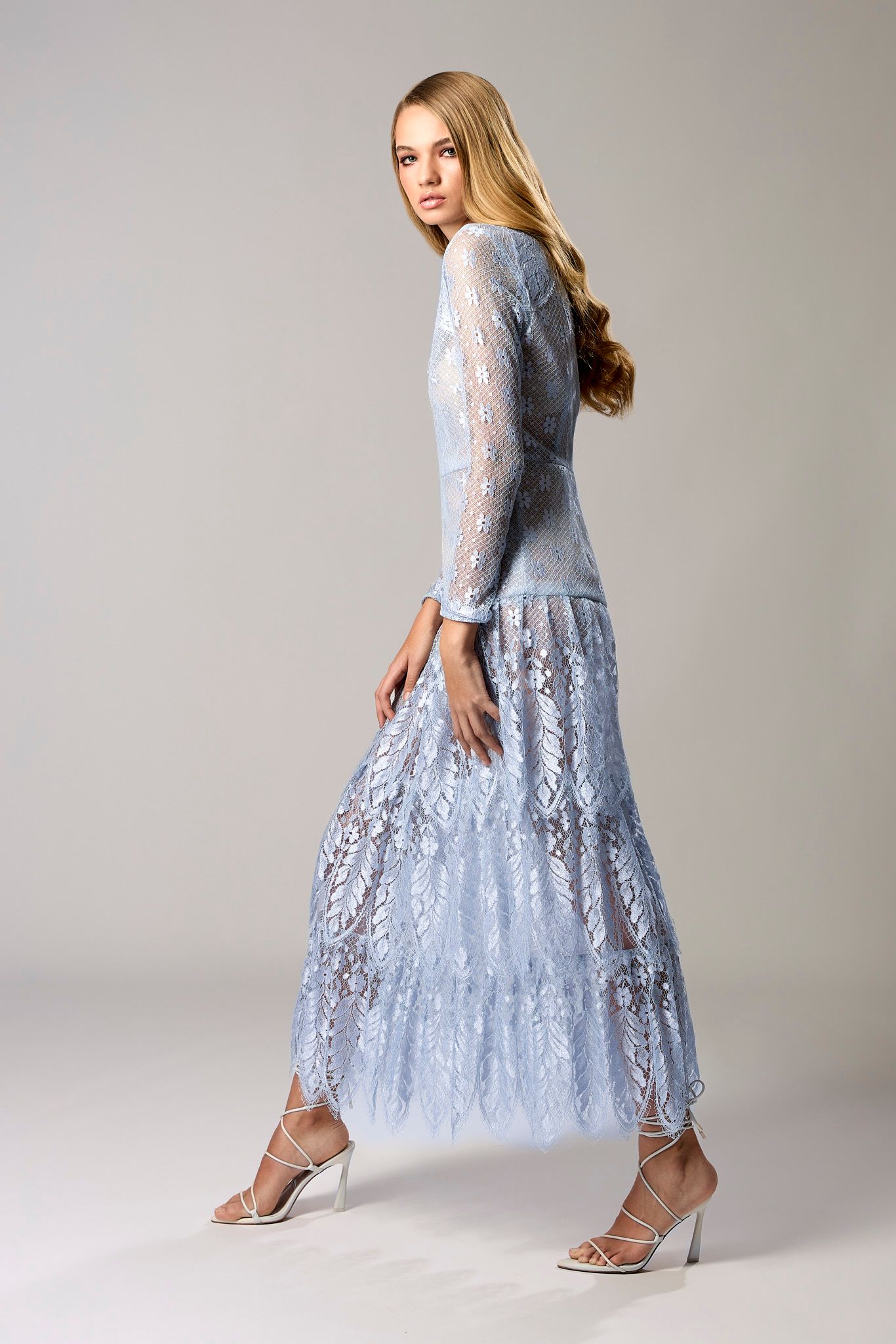 International top model wearing a elegant blue dress for NY Fashion week.