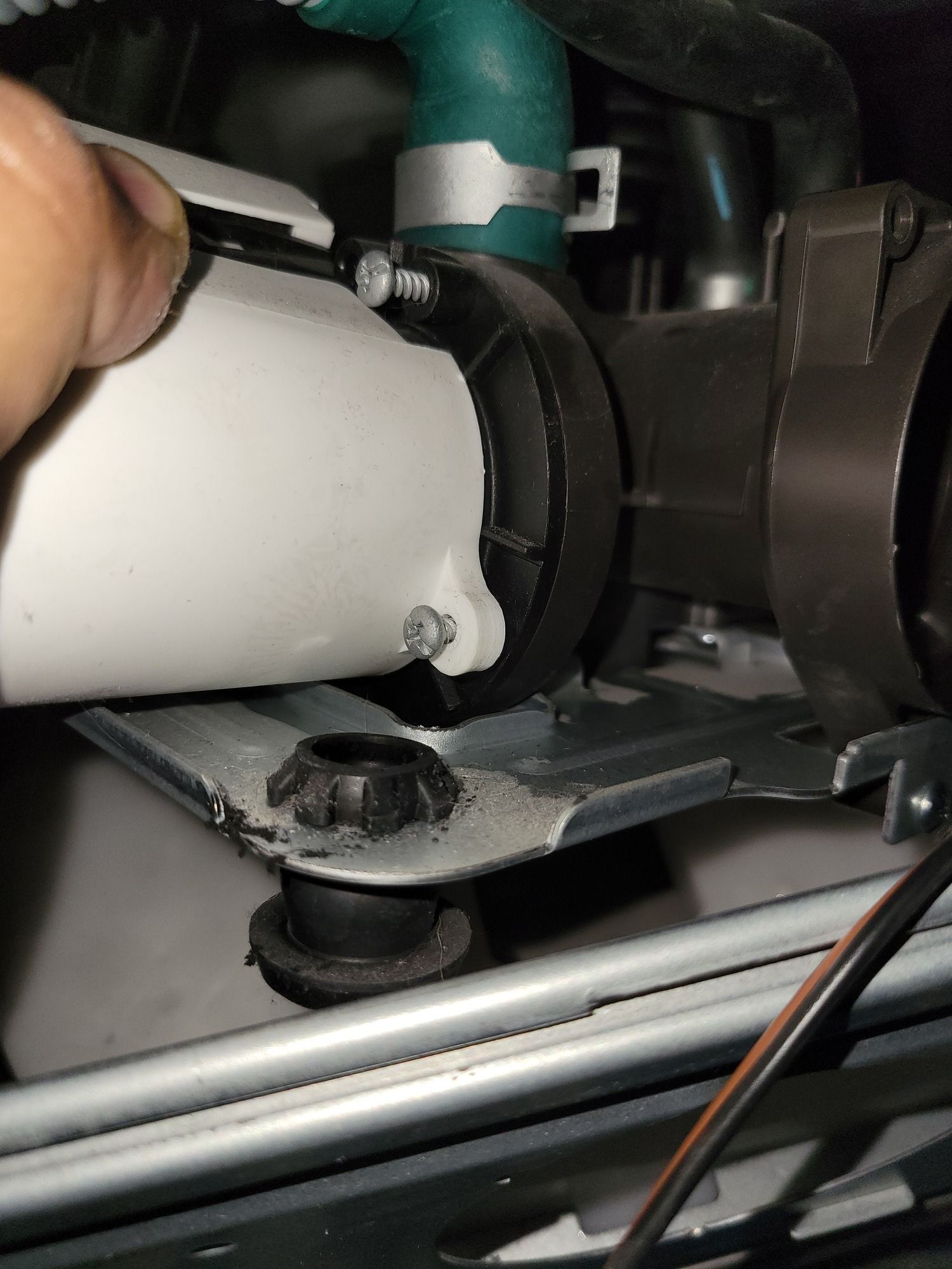 A close up of a person holding a pipe in their hand