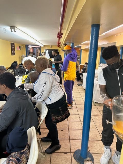 A group of people sitting at tables in a restaurant