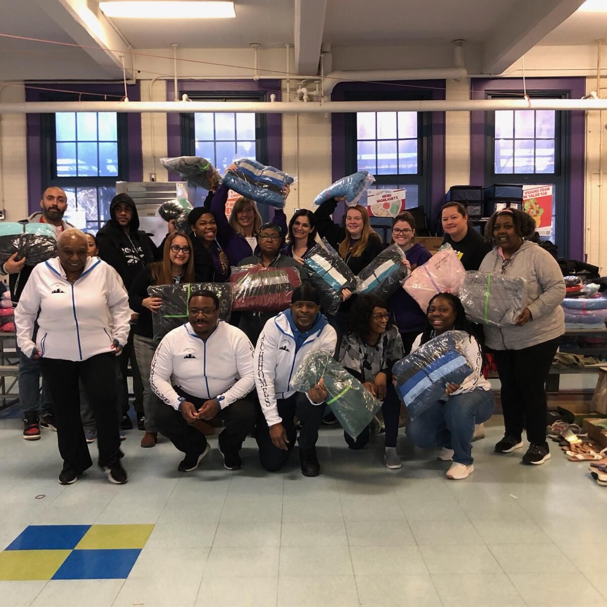 A group of people posing for a picture in a room