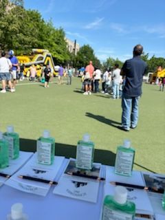 A table with bottles of hand sanitizer on it