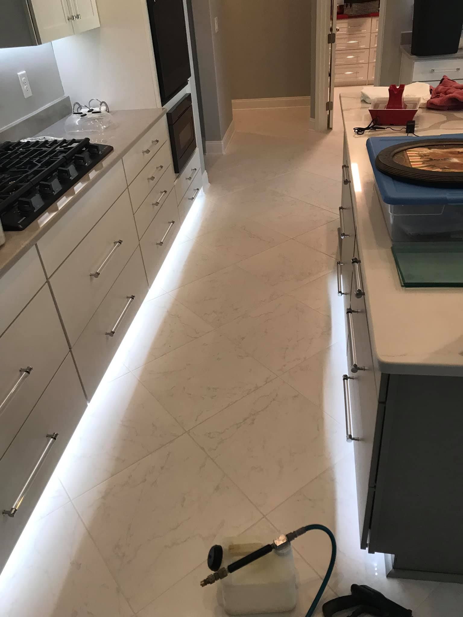 a kitchen with white cabinets and a stove top oven .