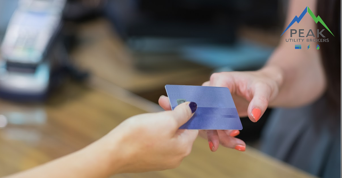 Woman Paying Using Card — Deerfield, IL — Peak Utility Brokers