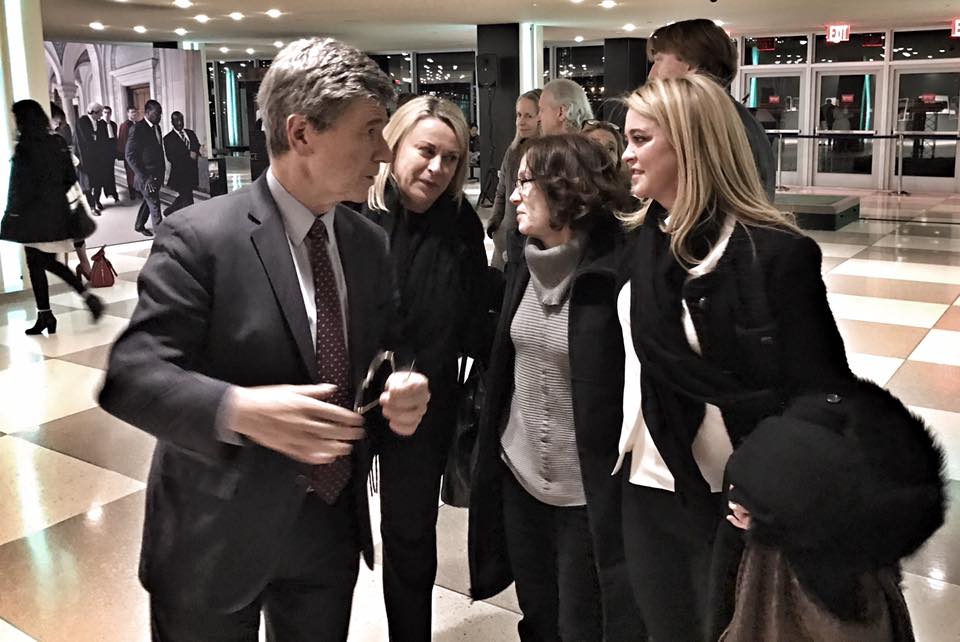 A group of people talking about the Millennium Villages Project and the Blue Chip Foundation