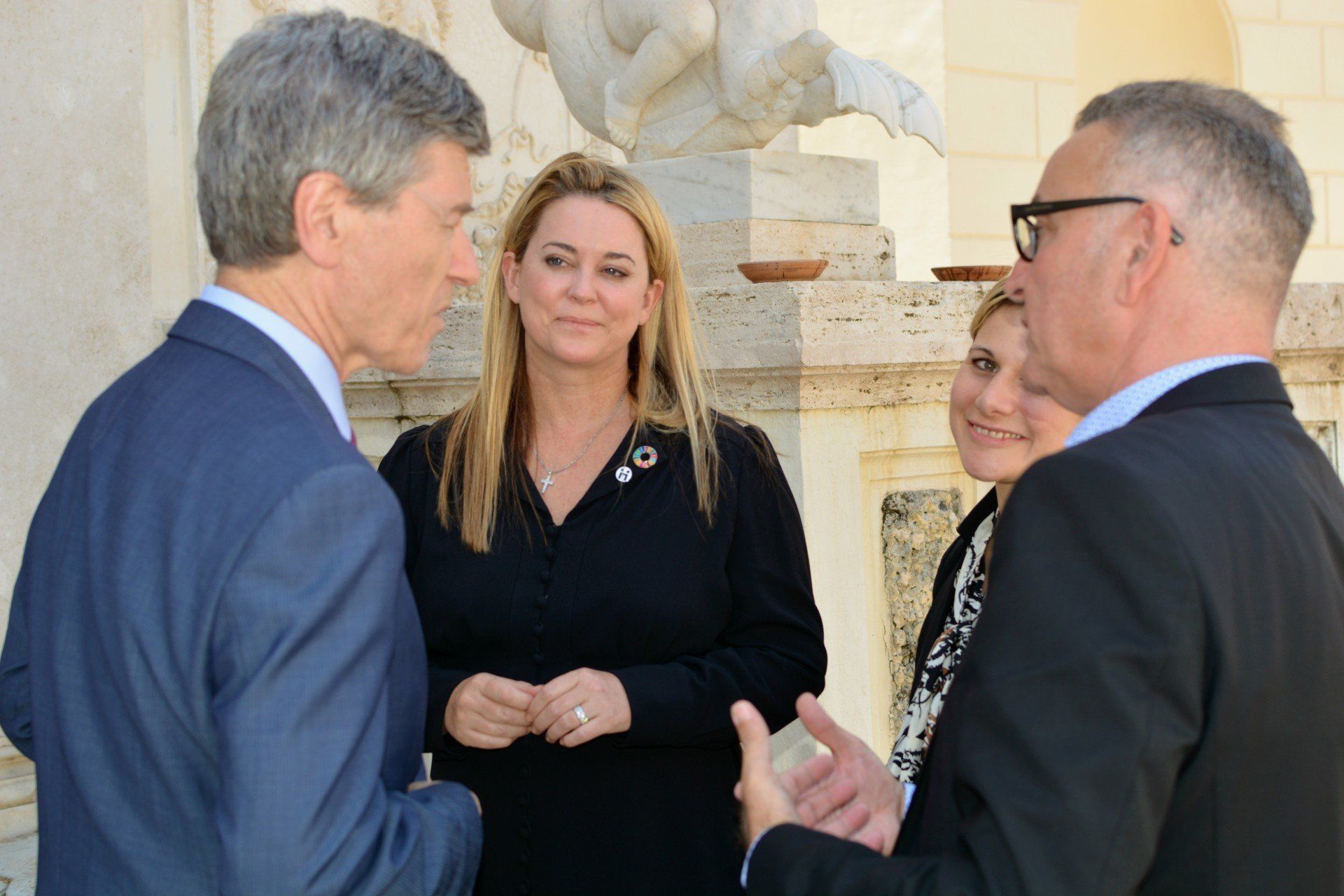 Jenifer Gross talking with a group of people during an Ethics in action meeting