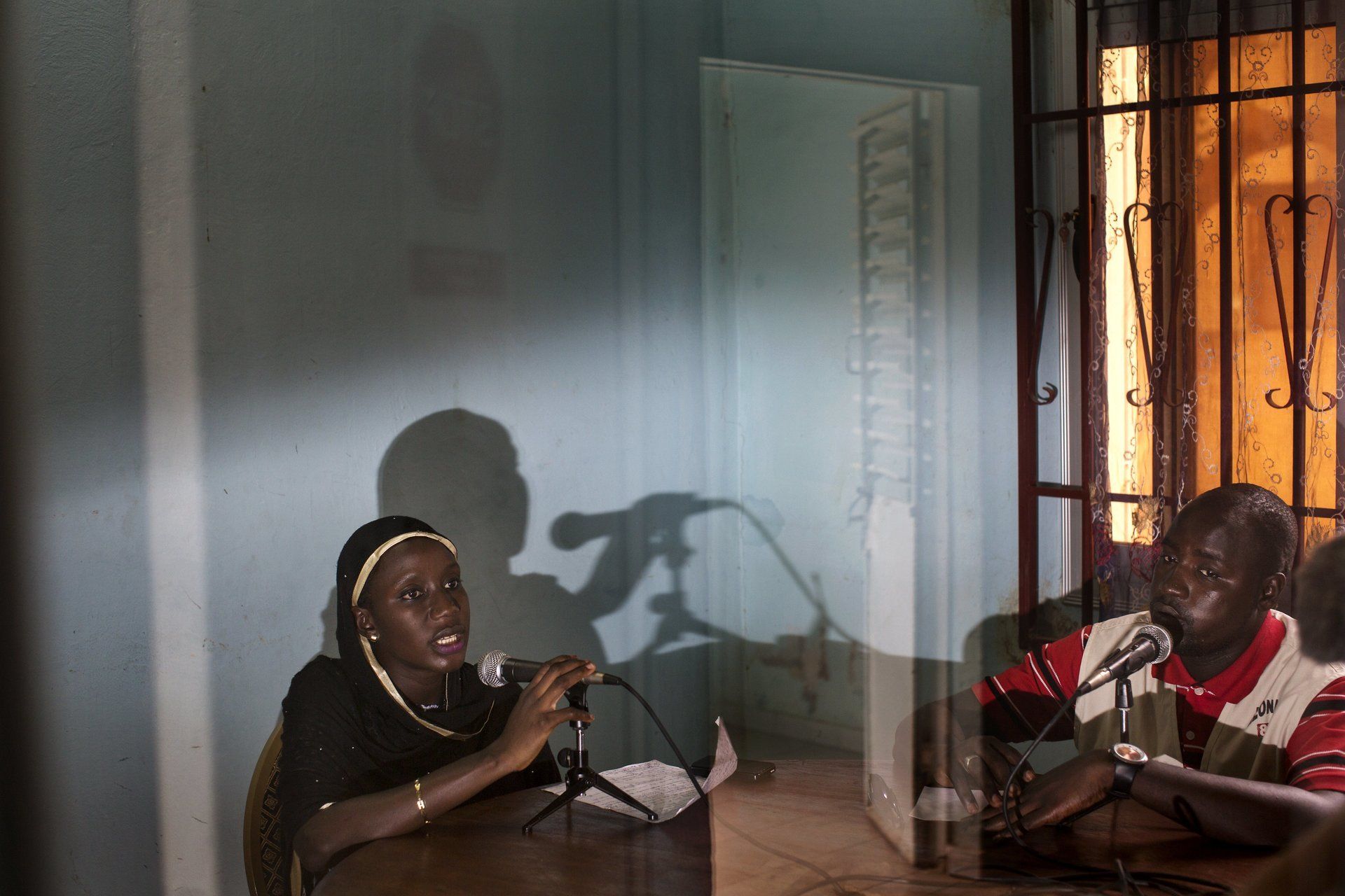 MVP: A women and man sitting at a table into a mic