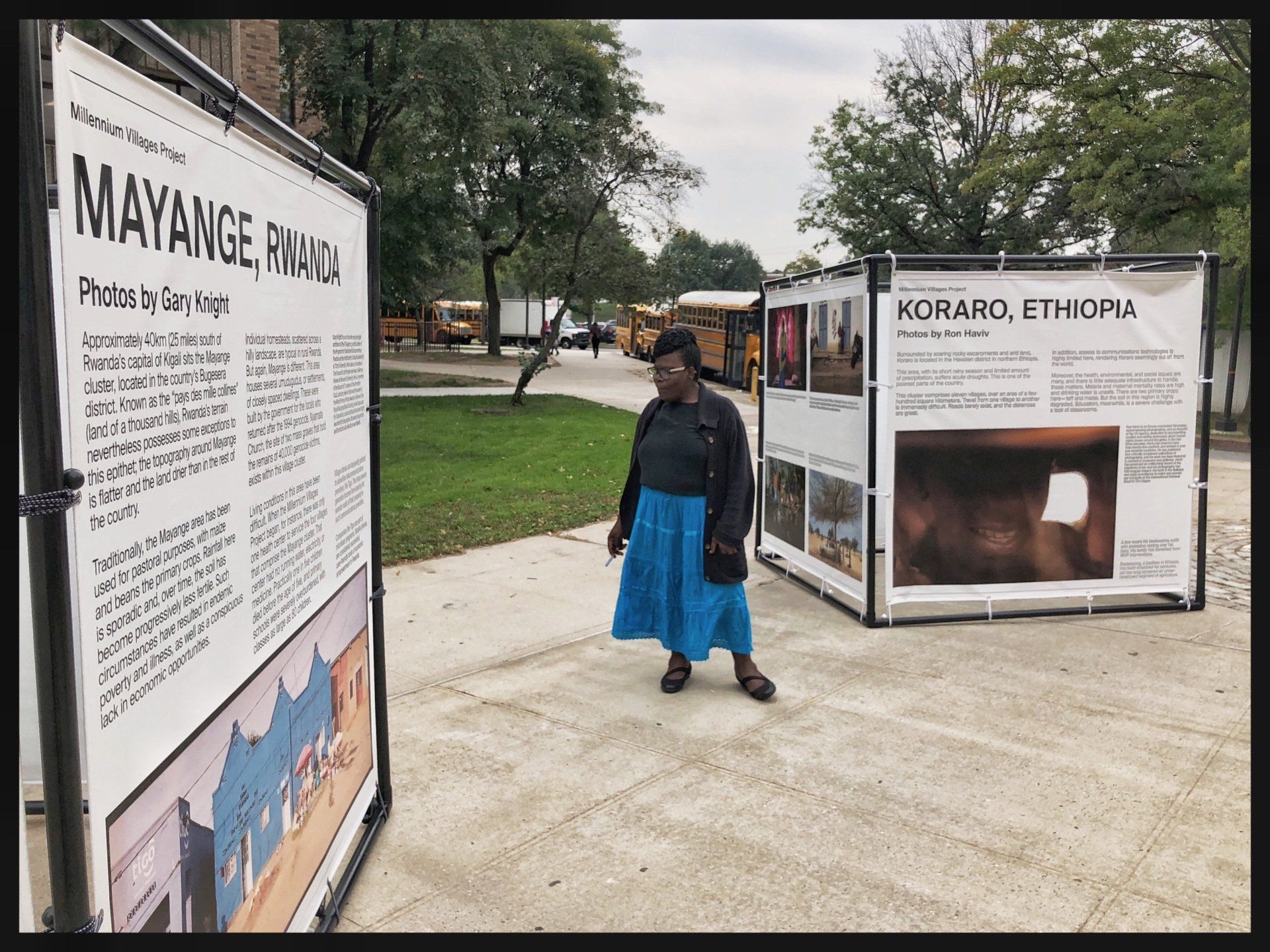 MVP Get on the Bus campaign signage at a bus stop where a women is reading it