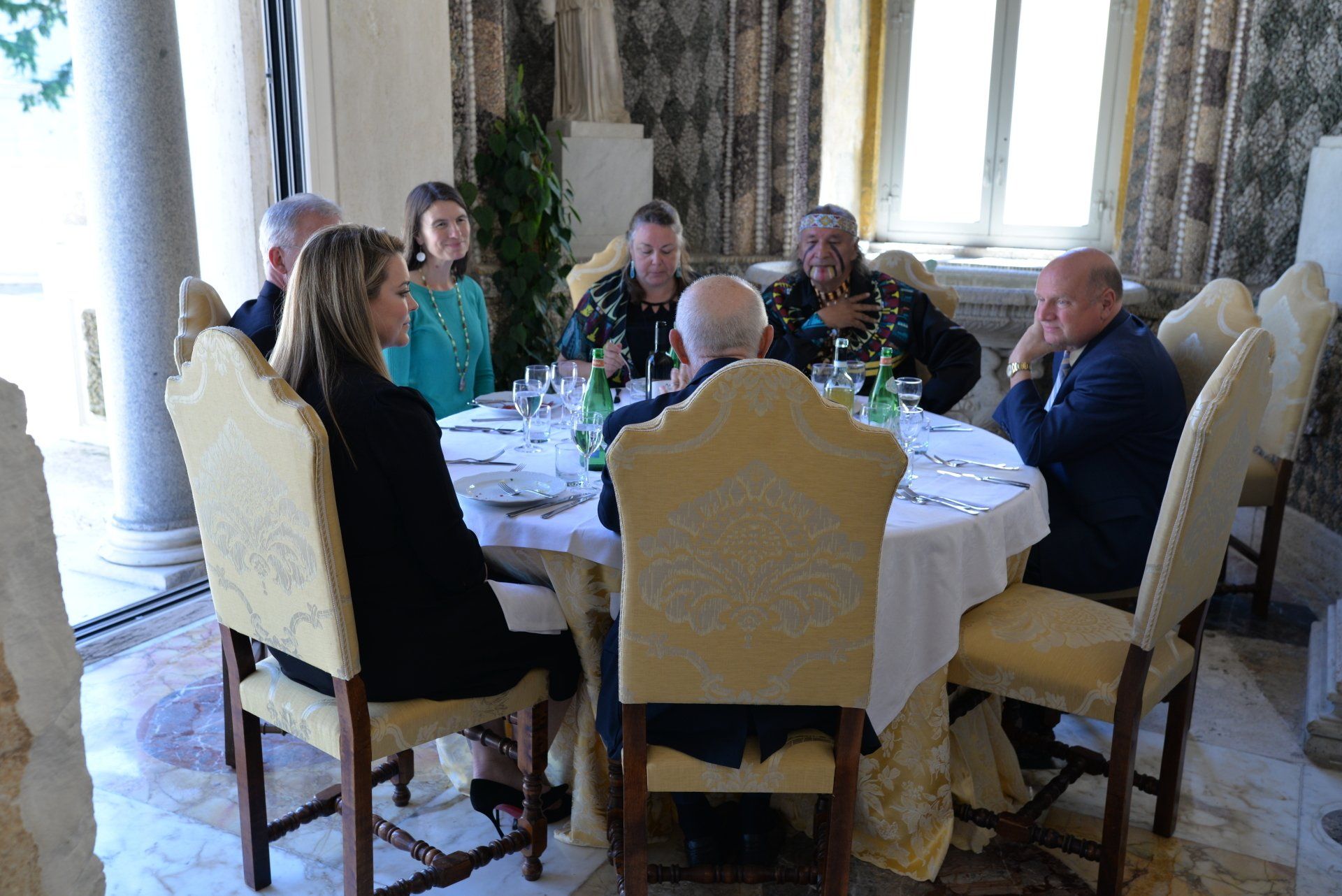 A group of people sitting around a table enjoying a meal