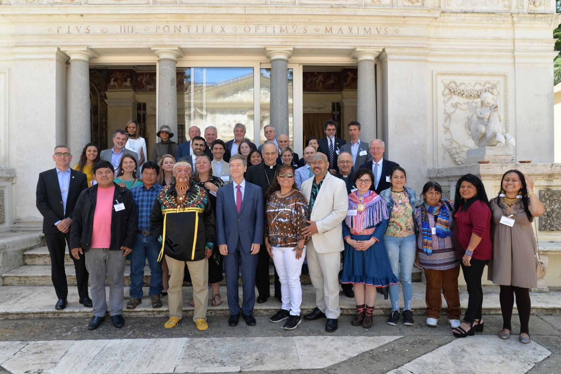 A group of people posing for a photo after a meeting about the indigenous people