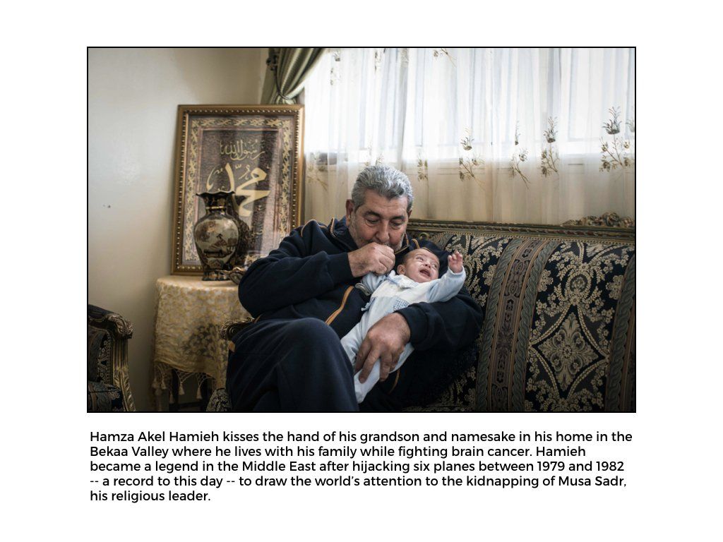 The Peace Project: A man (Hamza Akel Hamieh) holds his grandson and kisses his hand  in Lebanon