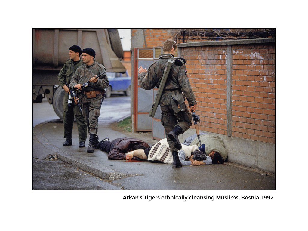 The Peace Project: People laying on the ground (dead) which military personal holding guns around them in Bosnia