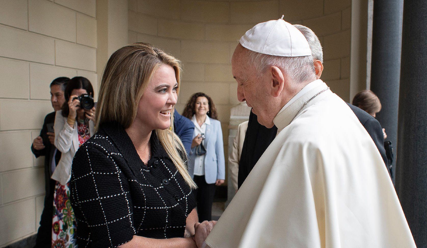 Jennifer Gross founder of Blue Chip Foundation talking to Pope Francis 