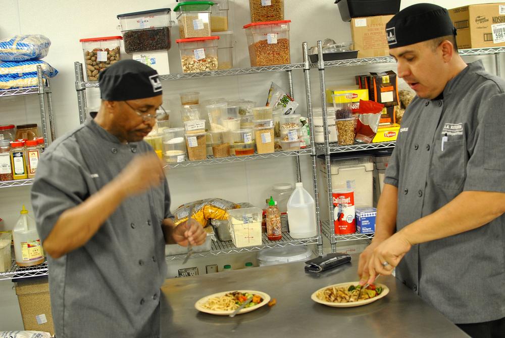 LA Kitchen a sustainable social enterprise organization students tasting their dinner creations