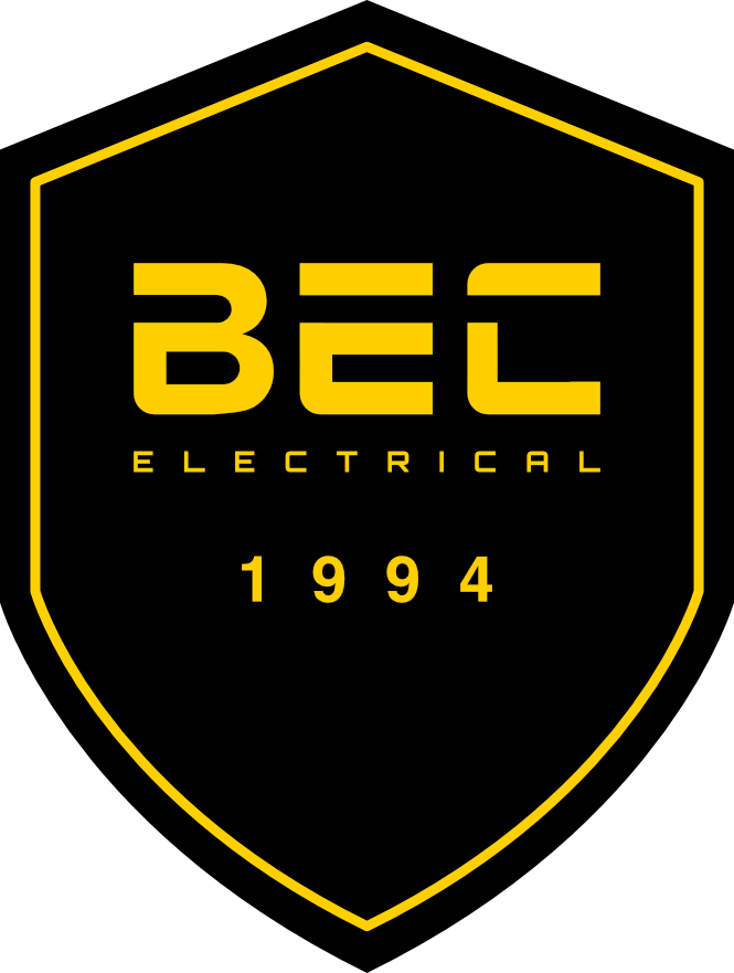 A yellow and black shield-shaped logo featuring the text 