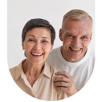 Two elderly people smiling, representing the positive results of dental care at Hampstead Clinic