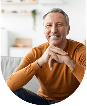 Smiling man with dental crowns, showcasing restoration and aesthetics at Hampstead Clinic