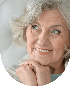 Older lady smiling, showcasing the benefits of full arch implants at Hampstead Clinic