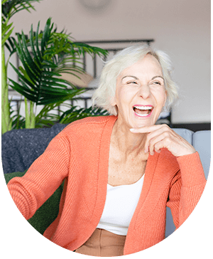 Older lady laughing, reflecting the positive outcomes of grafts and bone augmentation at Hampstead Clinic