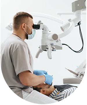 Dentist working on a patient with dental equipment, highlighting professional care at Hampstead Clinic