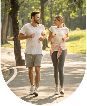 Man and woman talking after running, representing solutions for excessive perspiration at Hampstead Clinic