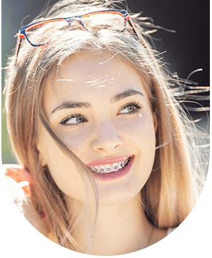 woman with braces, highlighting general orthodontics treatments at Hampstead Clinic