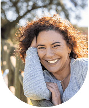 Lady smiling, representing successful results of root canal treatment at Hampstead Clinic