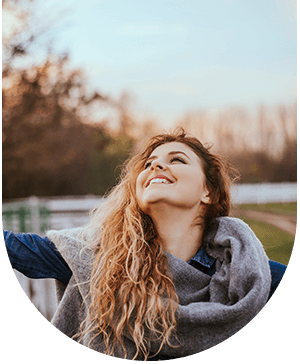 A Lady smiling, representing successful results of root canal treatment at Hampstead Clinic