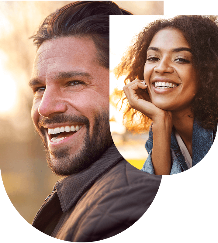 Man and woman showing bright smiles, highlighting tooth whitening benefits