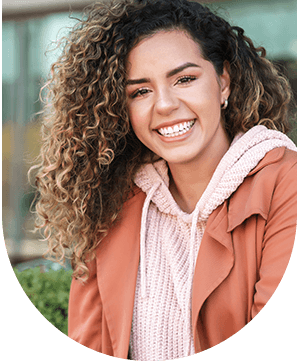 woman showing bright smiles, highlighting tooth whitening benefits