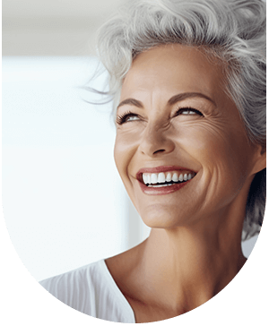 Close-up of an older woman smiling, showcasing the results of composite bonding veneers at Hampstead Clinic