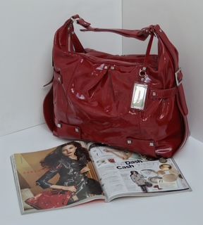 Red tote, Karen Millen.  As seen in Vogue, Autumn-Winter 09.