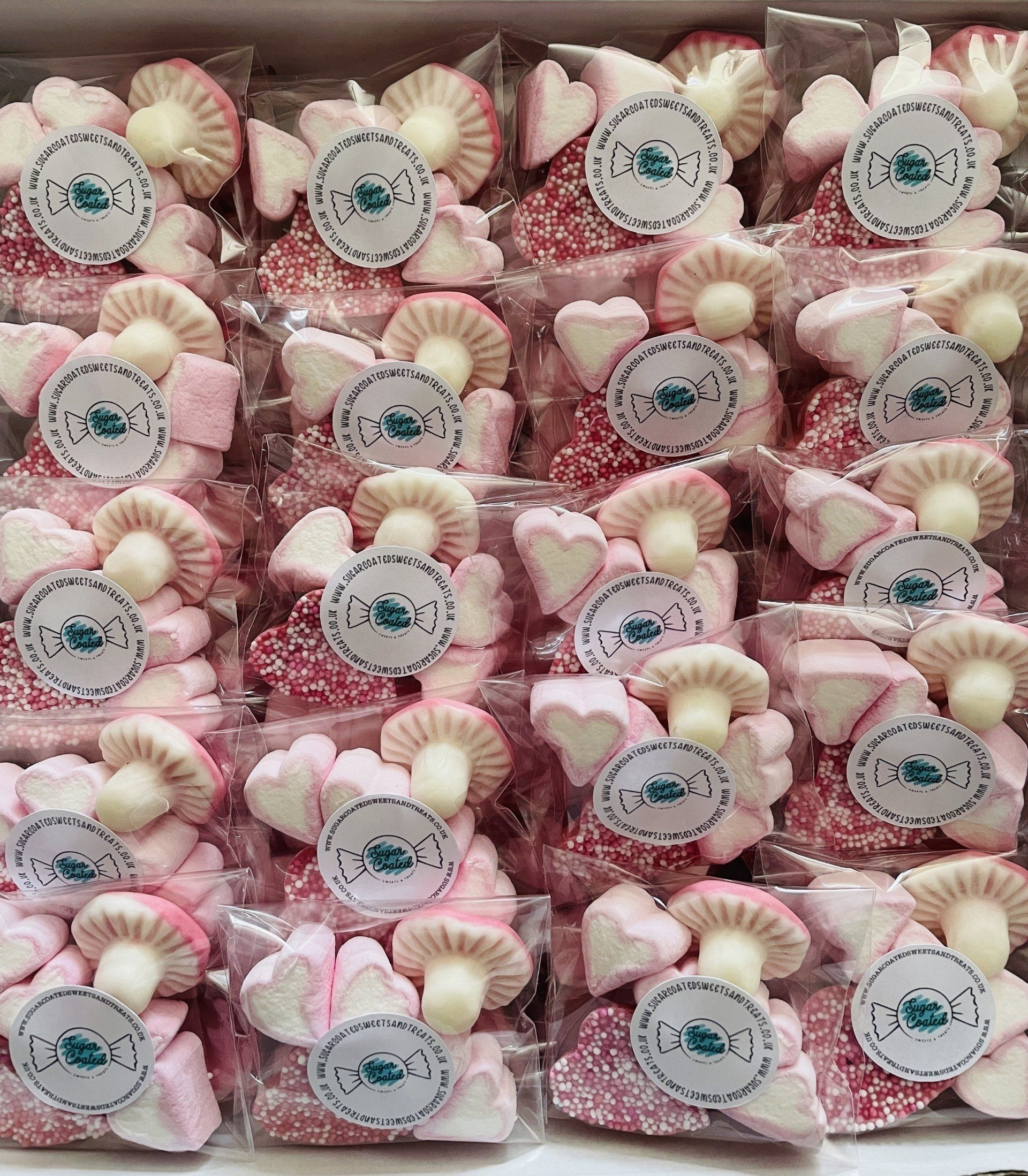 A bunch of bags of marshmallows in the shape of flowers.