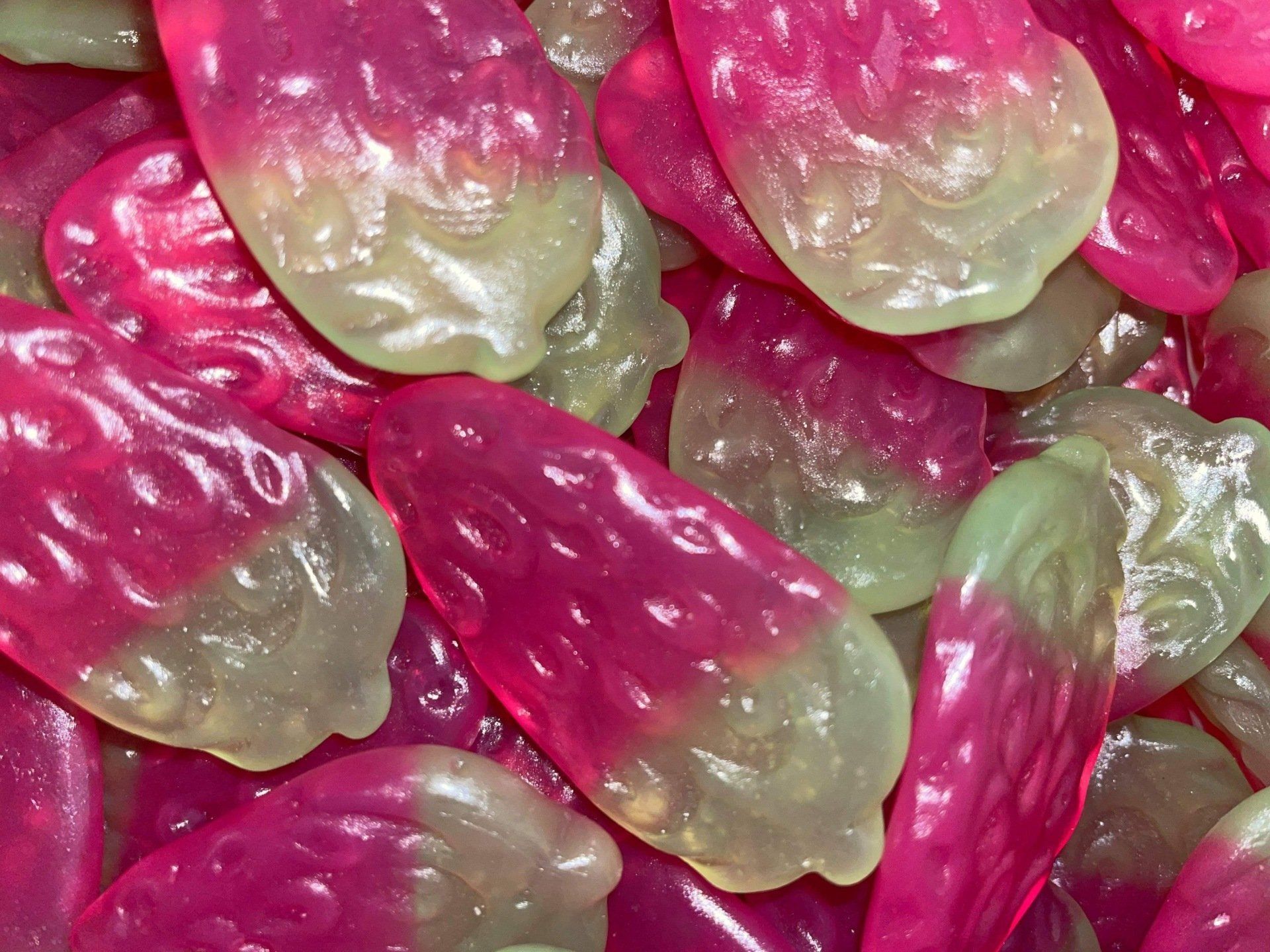 A close up of a pile of pink and green candy