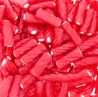 A close up of a pile of red licorice sticks