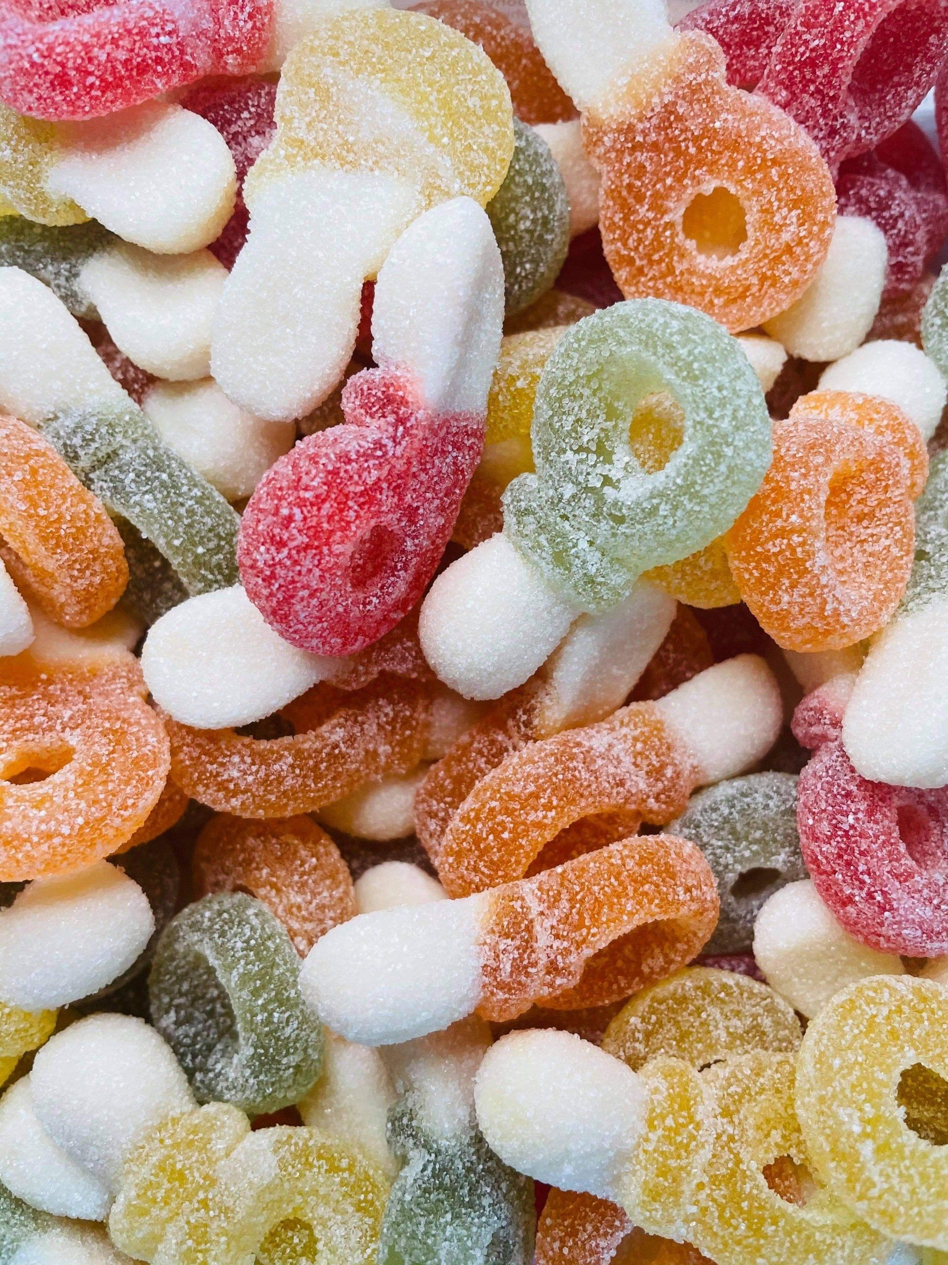 A close up of a pile of gummy candies