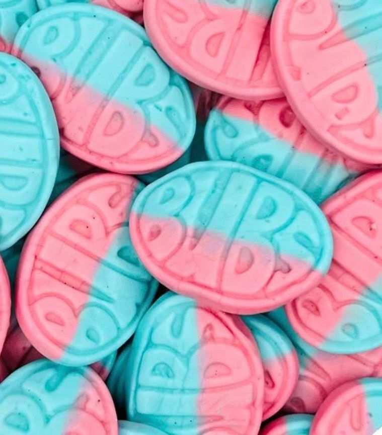 A pile of pink and blue super daddy candies