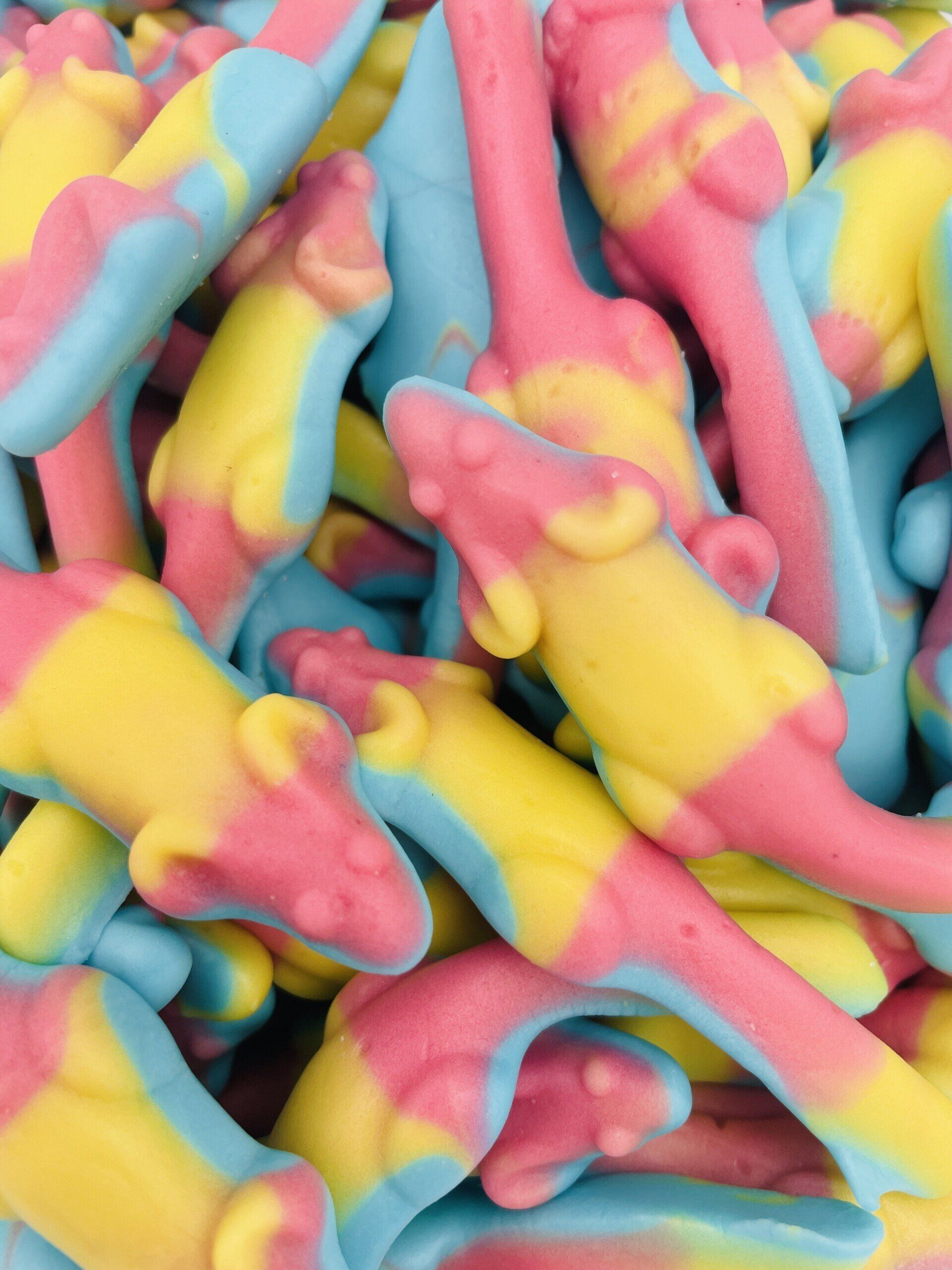 A pile of pink and yellow gummy mice