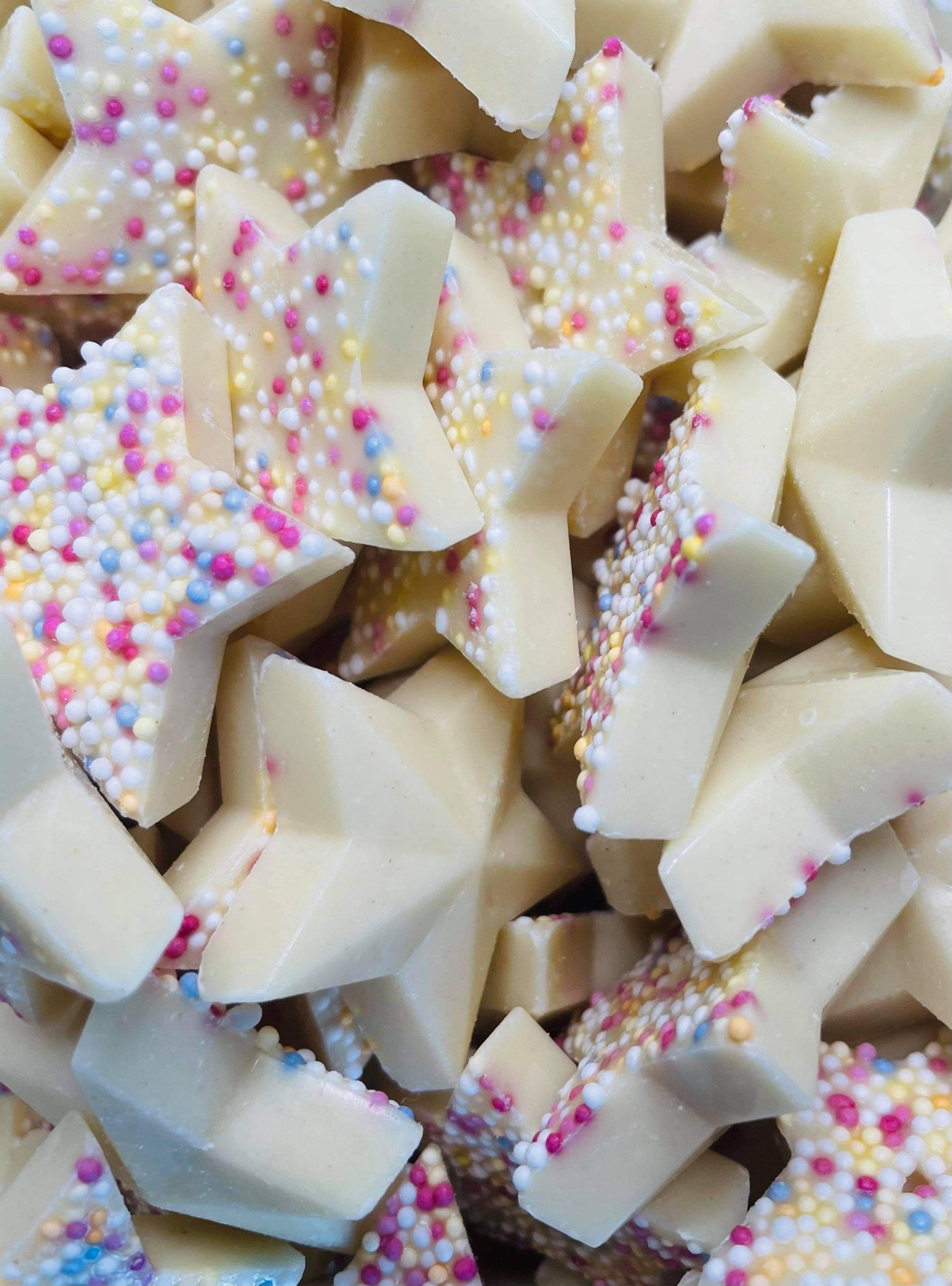 A pile of white chocolate with sprinkles on top